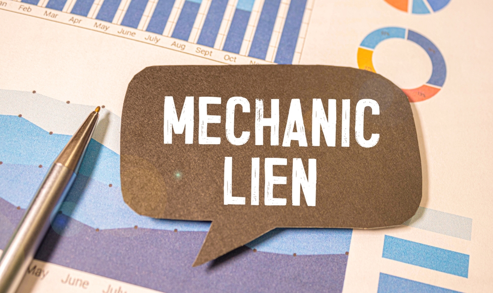 Mechanic lien concept with charts and pen on desk